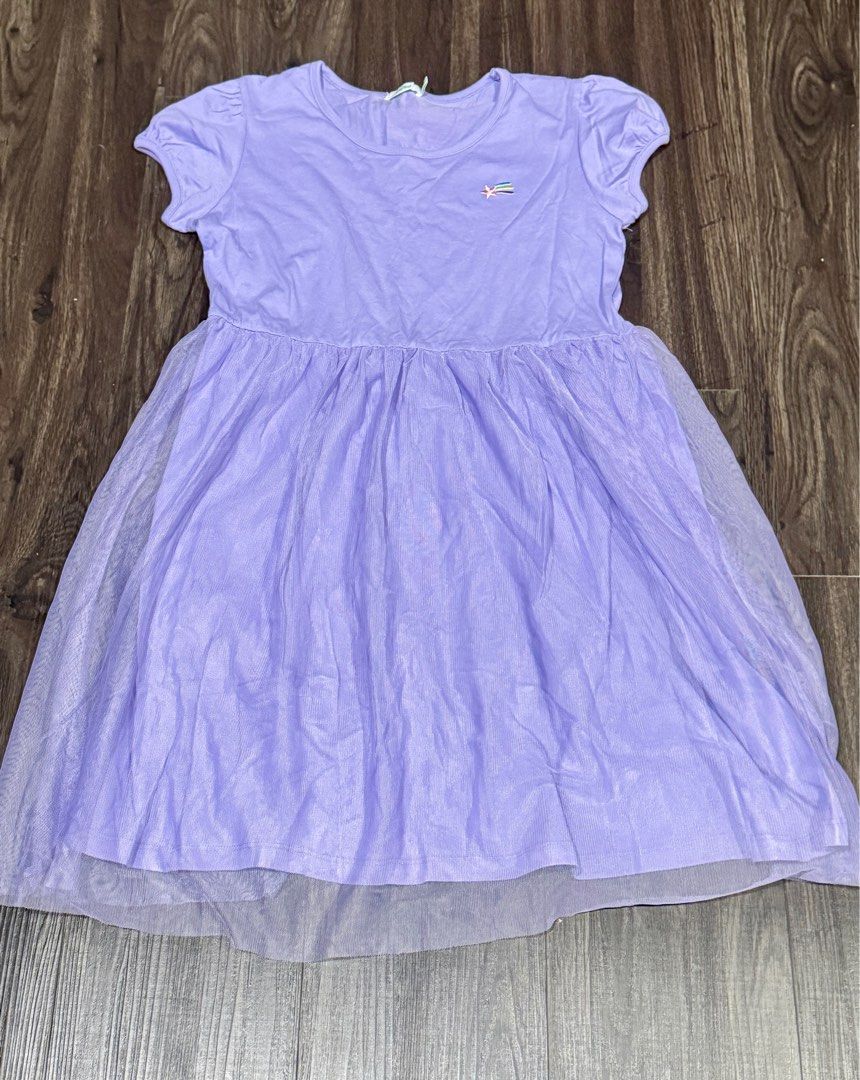 Bossini Purple Dress - Size 160 (Category: Babies & Kids Fashion) located in Singapore. Submitted by allyvivian (Listing ID 1377666173, Image 2). Description: Lovely purple dress from Bossini. Features a tulle skirt and short sleeves. Size 160, suitable for older children or teens. Perfect for parties or everyday wear. In excellent condition..
