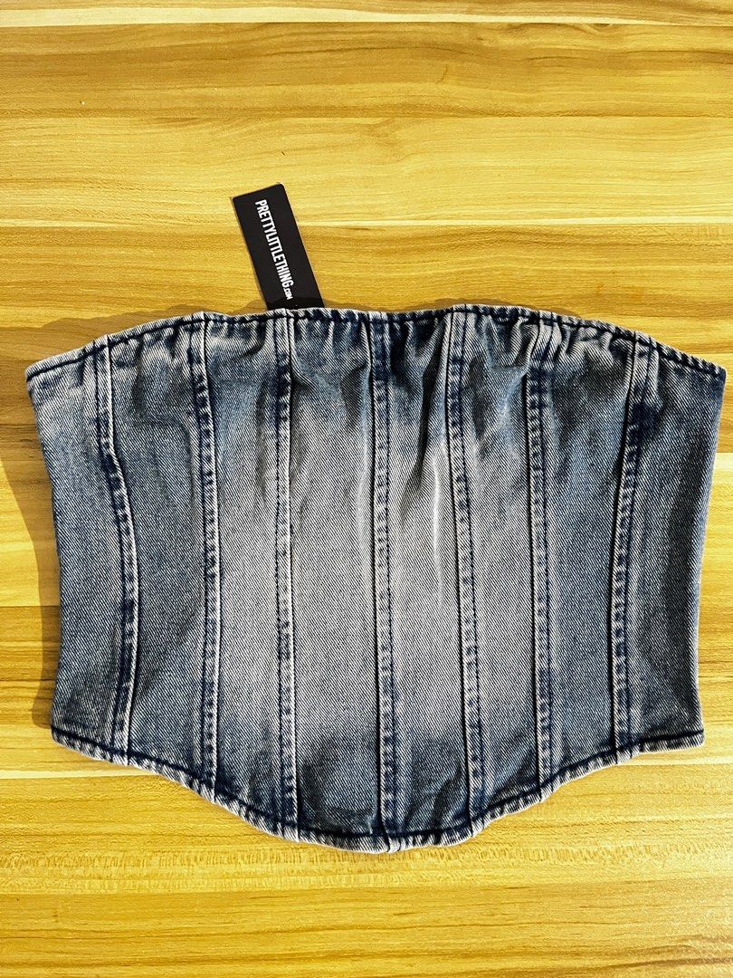 BRANDNEW TUBE CORSET (Category: Sleeveless) located in San Fernando. Submitted by declutterbydani__ (Listing ID 1377695812, Image 1). Description: brandnew prettylittlething denim tube corset best fit small-semi med size 8 on tag • payment via gcash • shipping via regular j&t • la union based .