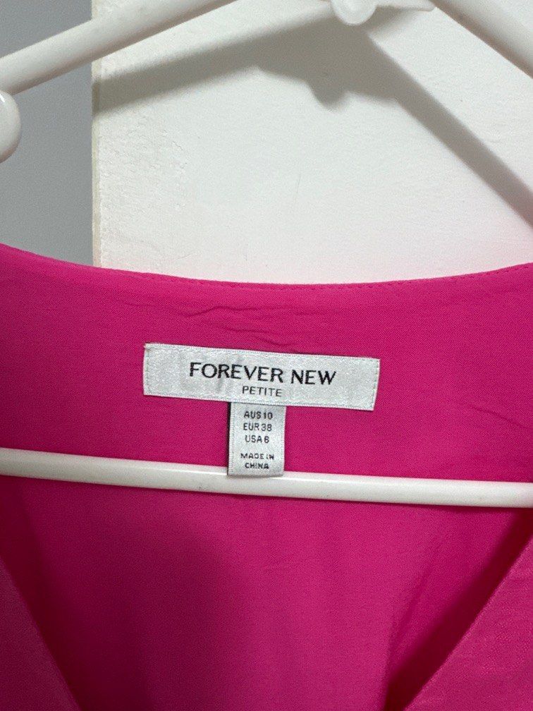 Forever New Fuschia Dress (Category: Women's Clothes) located in Liverpool. Submitted by joliee_ (Listing ID 1377625785, Image 2). Description: Purchased for $120 however selling for cheap due to the tear in the back (as in image) It’s a short, fit and flare dress, very flattering with puffy sleeves. .