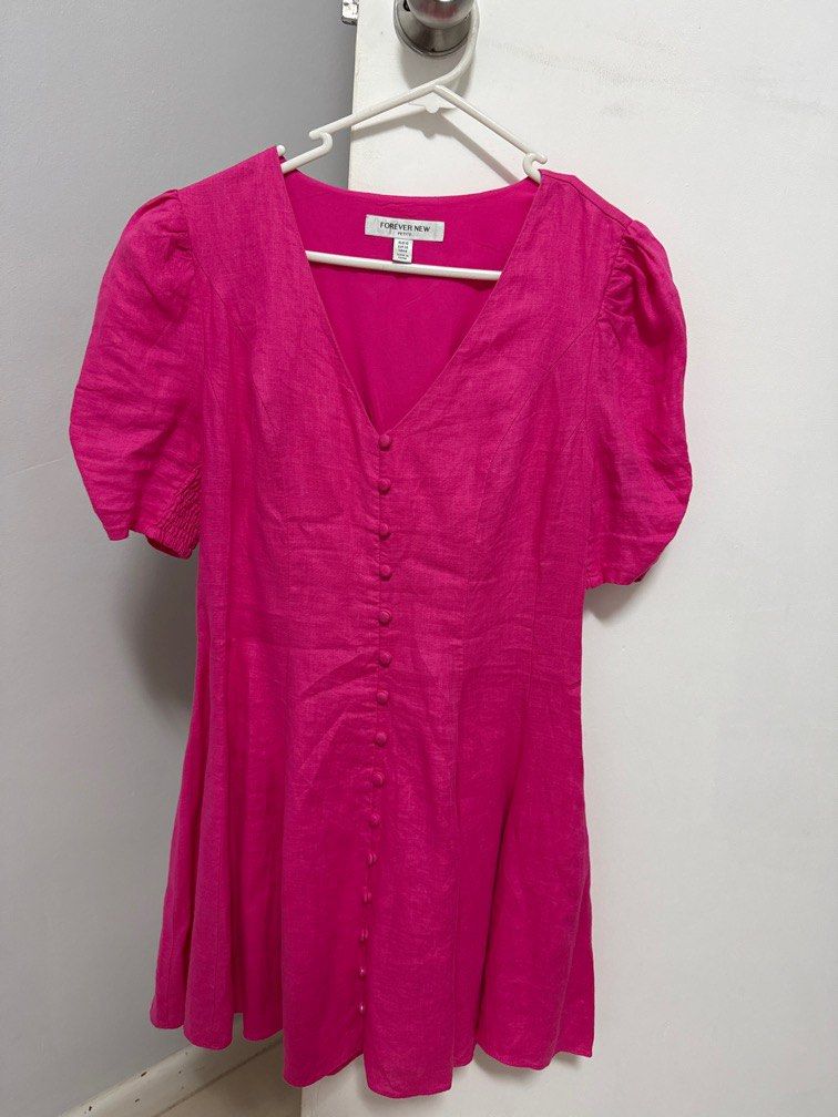 Forever New Fuschia Dress (Category: Women's Clothes) located in Liverpool. Submitted by joliee_ (Listing ID 1377625785, Image 1). Description: Purchased for $120 however selling for cheap due to the tear in the back (as in image) It’s a short, fit and flare dress, very flattering with puffy sleeves. .