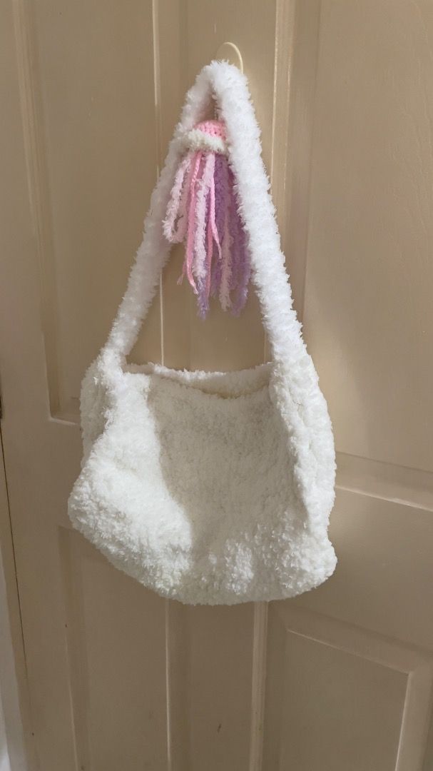Handmade Crochet Fluffy Fur White Bag (Category: Shoulder Bags) located in Iloilo. Submitted by fmmchr (Listing ID 1377615530, Image 2). Description: - Crocheted this bag using white chenille yarn - Length: Approx. 11 inches - Width: Approx. 13 inches - With inner lining and zipper - Shipping fee is shouldered by the buyer either thru J&T or LBC - Price is negotiable :).