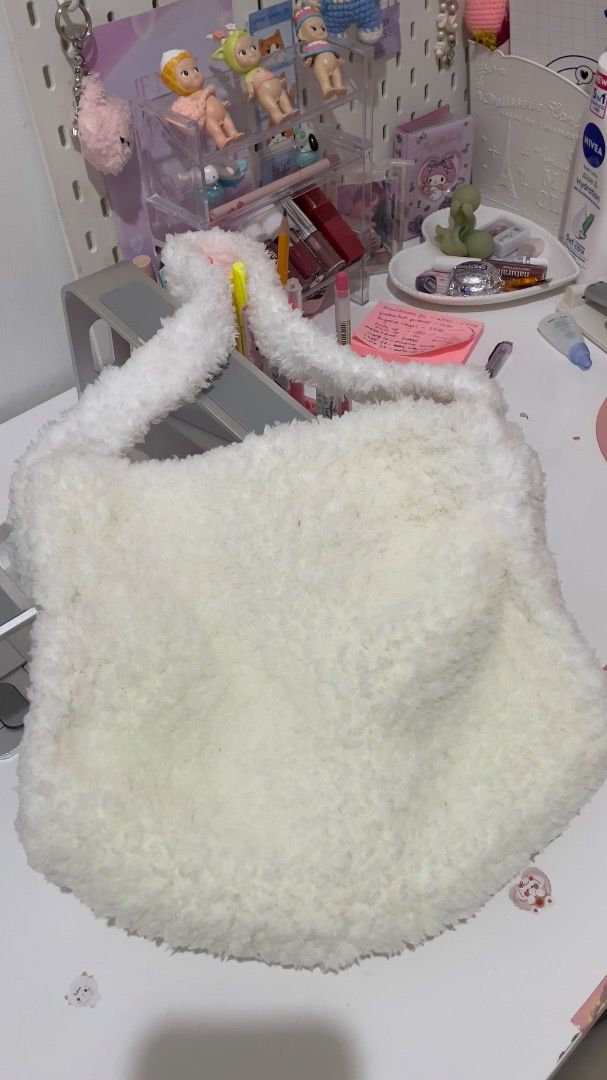 Handmade Crochet Fluffy Fur White Bag (Category: Shoulder Bags) located in Iloilo. Submitted by fmmchr (Listing ID 1377615530, Image 3). Description: - Crocheted this bag using white chenille yarn - Length: Approx. 11 inches - Width: Approx. 13 inches - With inner lining and zipper - Shipping fee is shouldered by the buyer either thru J&T or LBC - Price is negotiable :).