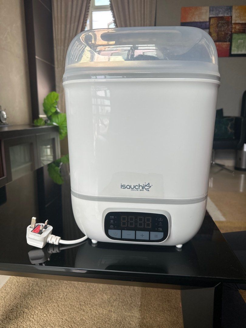 Isauchi 4-in-1 Digital Sterilizer & Dryer (Category: Breastfeeding & Bottle Feeding) located in Singapore. Submitted by poornima.ravi89 (Listing ID 1377582789, Image 1). Description: This Isouchi 4-in-1 sterilizer and dryer keeps bottles and accessories sterile for up to 12 hours if unopened. It features a digital touch panel with multiple functions: sterilize & dryer, dryer, sterilize, retain temperature, bottle warmer, and dry fruits. Includes 