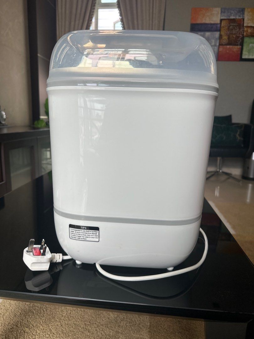 Isauchi 4-in-1 Digital Sterilizer & Dryer (Category: Breastfeeding & Bottle Feeding) located in Singapore. Submitted by poornima.ravi89 (Listing ID 1377582789, Image 2). Description: This Isouchi 4-in-1 sterilizer and dryer keeps bottles and accessories sterile for up to 12 hours if unopened. It features a digital touch panel with multiple functions: sterilize & dryer, dryer, sterilize, retain temperature, bottle warmer, and dry fruits. Includes 