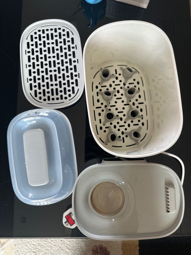 Isauchi 4-in-1 Digital Sterilizer & Dryer (Category: Breastfeeding & Bottle Feeding) located in Singapore. Submitted by poornima.ravi89 (Listing ID 1377582789, Image 3). Description: This Isouchi 4-in-1 sterilizer and dryer keeps bottles and accessories sterile for up to 12 hours if unopened. It features a digital touch panel with multiple functions: sterilize & dryer, dryer, sterilize, retain temperature, bottle warmer, and dry fruits. Includes 