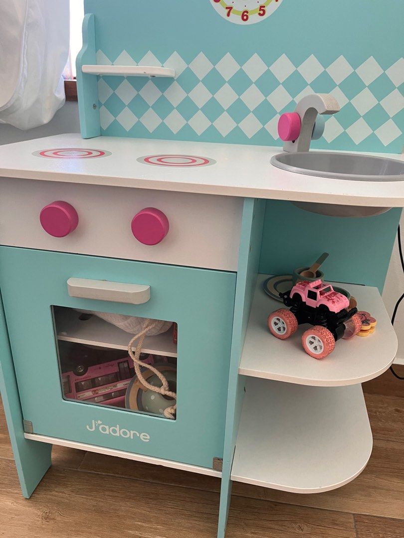 QUICK SALE! J'adore Wooden Toy Kitchen (Category: Infant Playtime) located in Singapore. Submitted by jomojom (Listing ID 1377656666, Image 1). Description: J'adore wooden toy kitchen in excellent condition. Includes only a limited number of kitchen toys. .