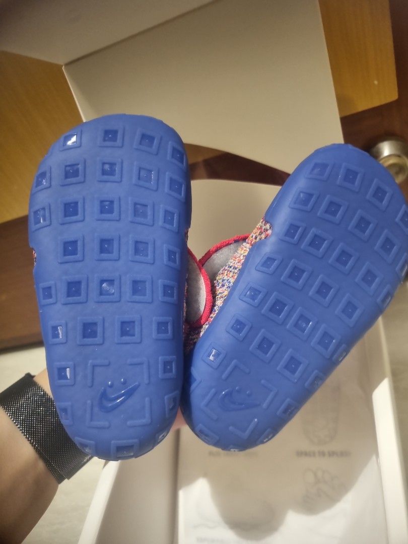 Nike Swoosh 1 (TD) Baby Shoes - Size 7C (Category: Babies & Kids Fashion) located in Singapore. Submitted by dogbarkcatmeow (Listing ID 1377705382, Image 3). Description: Nike Swoosh 1 Flyknit baby shoes - Vibrant multicoloured knit.Features blue accents and a red collar. - Includes original box. - RTP $85 Selling as we have procured another colour instead. $70, fast deal $65. - Ideal for your little one!.