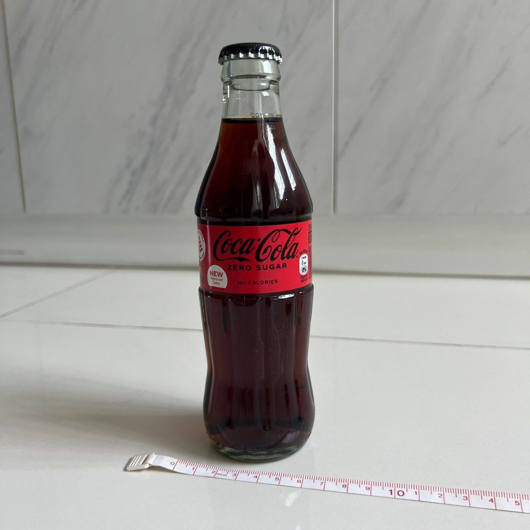 Old School Coke Zero Bottle (Category: Beverages) located in Singapore. Submitted by jadefe (Listing ID 1377707735, Image 1). Description: Calling all Coke Zero fans!!! Old school vintage bottle cap bottle. Add this to your home decor collection Most people sell regular Coca Cola bottles but this is the real deal for Coca Cola zero sugar lovers In pristine condition. Bottle is Not Dusty or sticky. Paper around the bottle is kept in good condition
