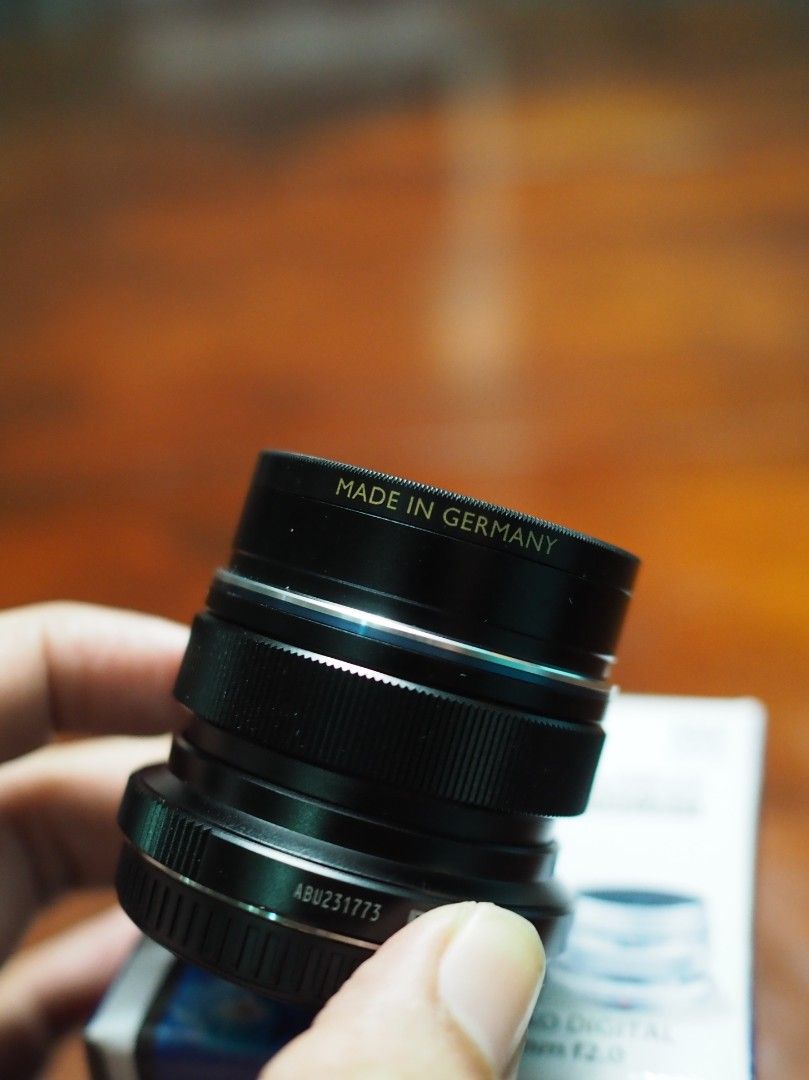 Olympus M.Zuiko 12mm f2.0 with B+W UV Filter (Category: Lens & Kits) located in Singapore. Submitted by ariprahasto (Listing ID 1377700436, Image 2). Description: full set including retail packaging. black colour. inclusive of 46mm B+W UV filter. Stored in dry cabi.