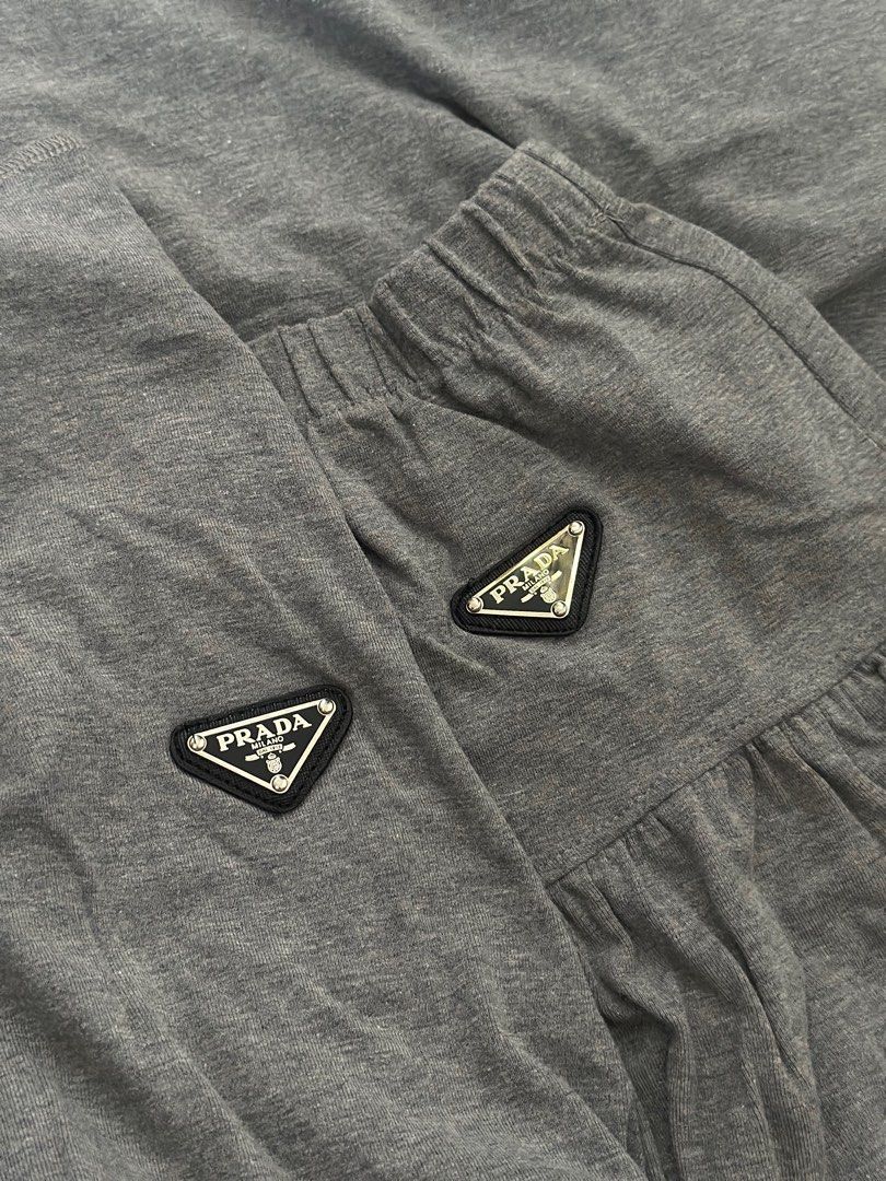 PRADA Grey Coordinates (Category: Sets or Coordinates) located in Manila. Submitted by mxriella (Listing ID 1377588012, Image 3). Description: — PRA.DA Co-ords — PRA.DA logo plaque on both the top and skirt — Fits to M-L — Used once in Korea — HQ — Rare and must have!💎 — Sobrang ganda neto🙌 .