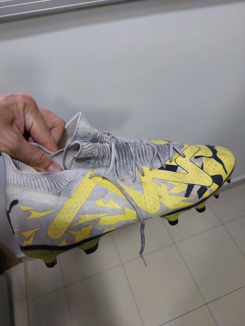 Puma Future Football Boots - Yellow and Grey (Category: Casual shoes) located in Singapore. Submitted by sunnygo01 (Listing ID 1377718839, Image 3). Description: - Used Puma football boots - Colour: Yellow and Grey - Good condition, with darkened skin due to futsal. - Used less than 10 times but not good fit for my feet hence Selling cheap .