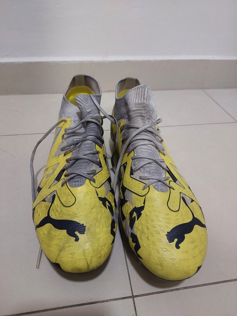 Puma Future Football Boots - Yellow and Grey (Category: Casual shoes) located in Singapore. Submitted by sunnygo01 (Listing ID 1377718839, Image 2). Description: - Used Puma football boots - Colour: Yellow and Grey - Good condition, with darkened skin due to futsal. - Used less than 10 times but not good fit for my feet hence Selling cheap .