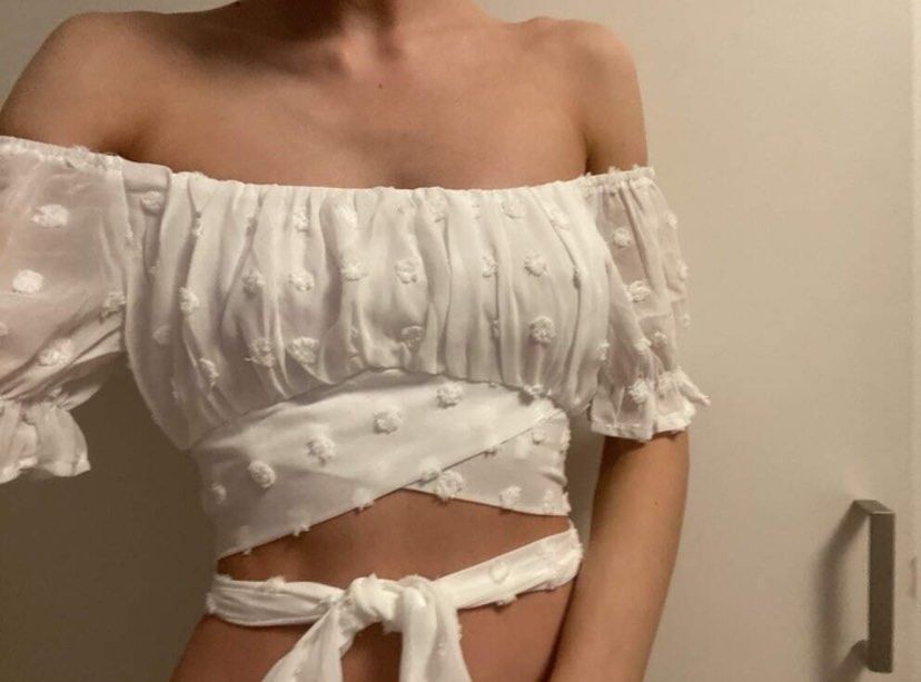 SHEIN white tie top (Category: Blouses) located in Pasig City. Submitted by skydecluttering (Listing ID 1377630149, Image 2). Description: NEVER USED stretchy .