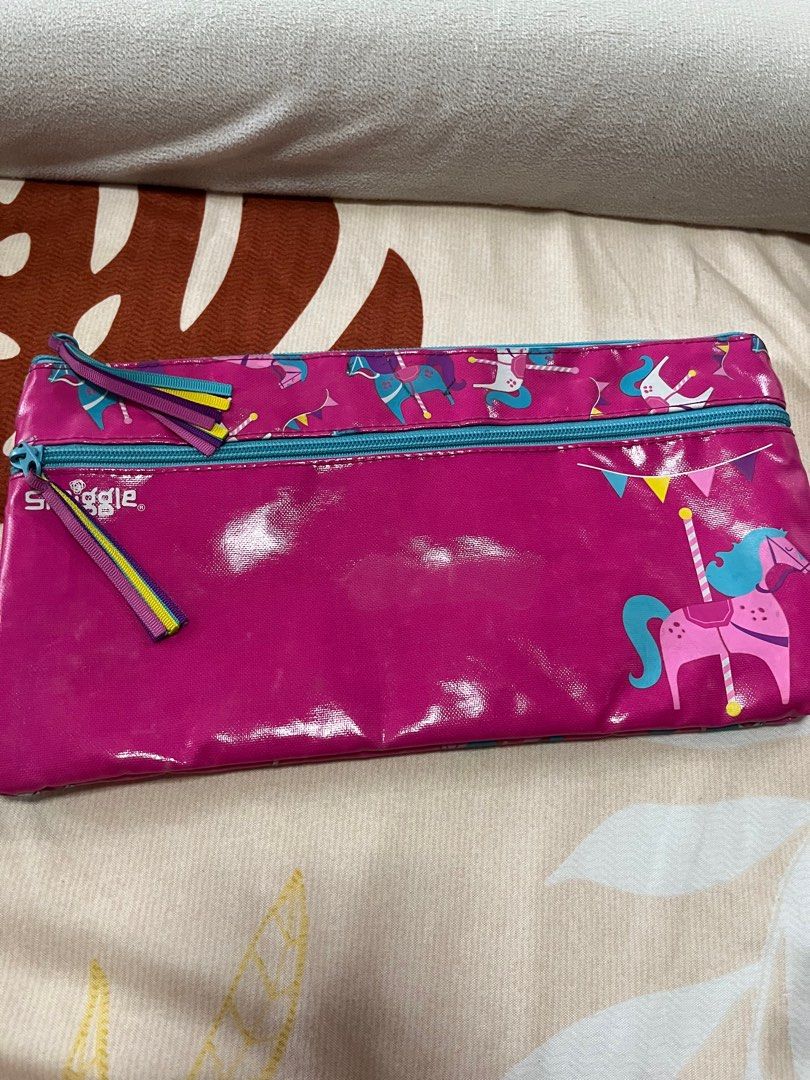 Smiggles carousel theme pencil case long pouch (Category: Stationery & School Supplies) located in Mandaluyong City. Submitted by stephmd (Listing ID 1377654615, Image 1). Description: Preowned Long pouch Double compartment Flaw: sticker mark 4th pic Very few faint ink marks inside 12.5 inches x 7 inches .