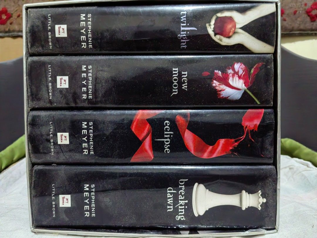 Twilight Bookset Hard Bound by Stephenie Meyer | Twilight Saga (Category: Storybooks) located in San Juan City. Submitted by mizerruki (Listing ID 1377734197, Image 1). Description: Sold as set. Pages are tanning. Please see photos. Twilight Eclipse New Moon Breaking Dawn.