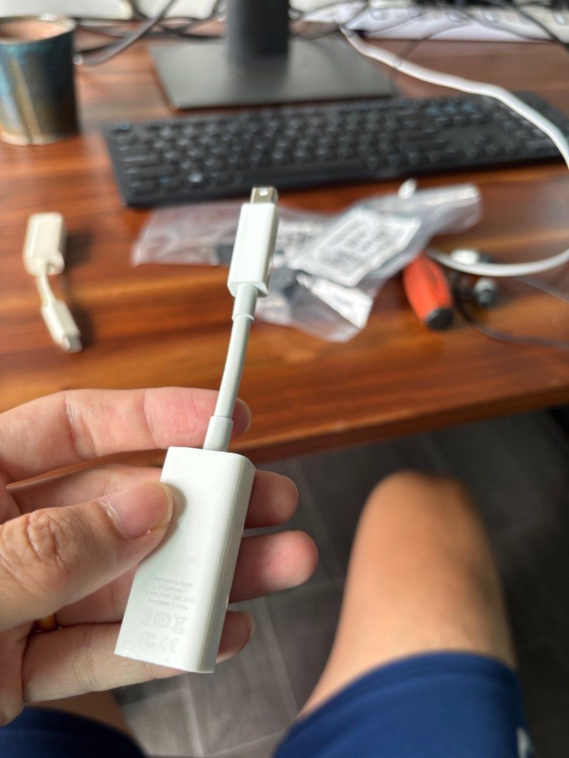 VGA to lightning and Ethernet to lightning adapters (Category: Cables & Adaptors) located in Singapore. Submitted by gainas (Listing ID 1377584192, Image 2). Description: Genuine Apple VGA adapter. Connects your Mac to a VGA display or projector. Shows some signs of use, but fully functional. Includes the adapter itself, as shown in the photos. Perfect for presentations or extending your display..