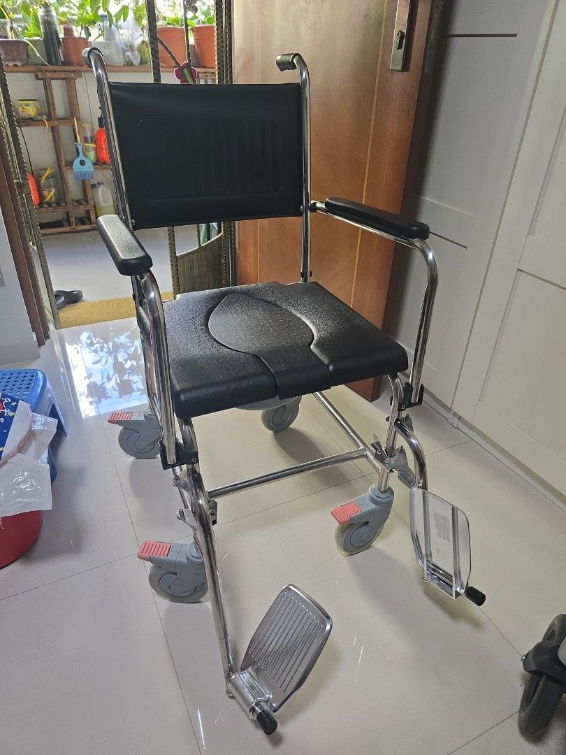 Wheelchair - Chrome Frame, Adjustable Footrests (Category: Wheelchairs) located in Singapore. Submitted by ndsoh11 (Listing ID 1377642108, Image 1). Description: - Durable wheelchair - Chrome frame - Adjustable footrests - Black seat and backrest - Wheels in good condition - Well-maintained.