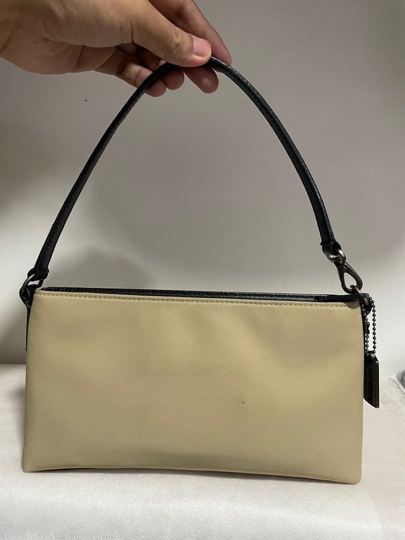 Authentic Coach mercer twill demi pouch (Category: Luxury Bags & Wallets) located in Guiguinto. Submitted by prelovedinc2024 (Listing ID 1372705842, Image 2). Description: guaranteed authentic, bought in Japan with signs of use - some dirt/stains, stains/rubs on corners combination of nylon and leather materials size: 9.5x5x1.5”.