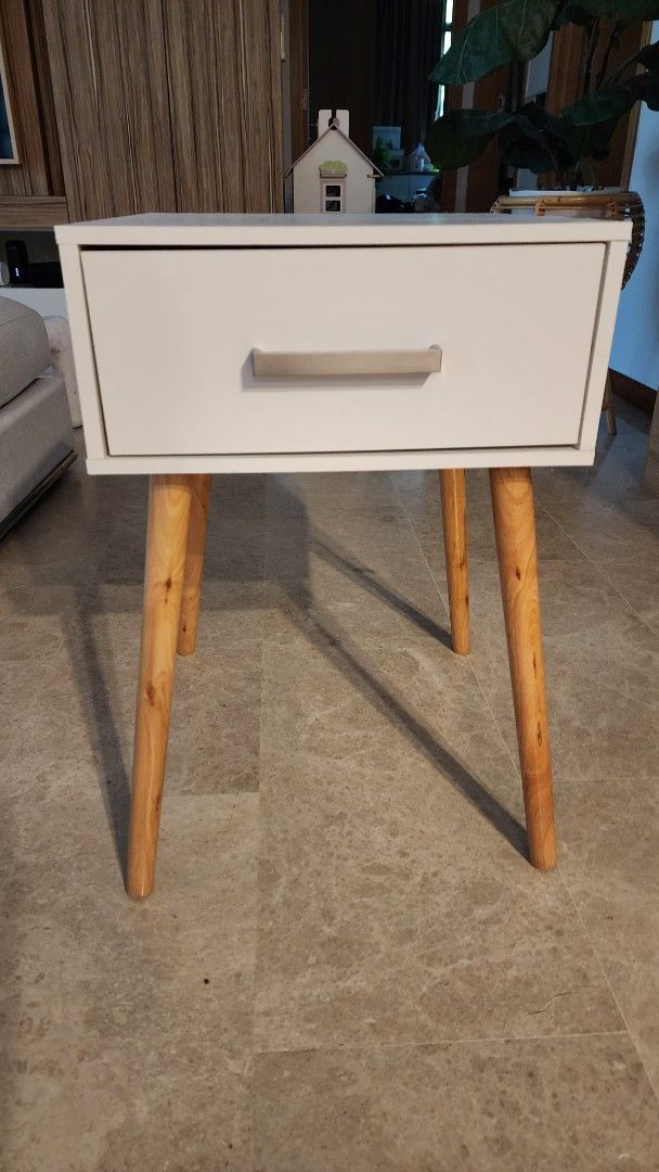 Bedside Table (Category: Shelves, Cabinets & Racks) located in Singapore. Submitted by treasured_gems (Listing ID 1372744906, Image 1). Description: Bedside table in white. Some marking on top but not noticeable once you place items on top. Price reflects - not for fussy buyers. Good for general guest room or a little side project! Pick up Newton.