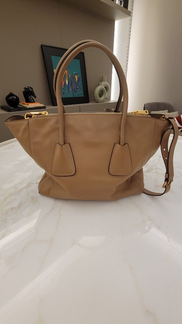 Prada Tote Twin Pocket Handle Beige Calf (Category: Luxury Bags & Wallets) located in San Juan City. Submitted by closetzoneph (Listing ID 1372794453, Image 2). Description: Prada Tote Twin Pocket Handle Beige Calf P48,000 - 8.5/10 - Preloved, just the bag no receipts or box - 100% Authentic - Can give more photos just request Prada Tote Beige Medium Large Calf Vitello Daino Saffiano MCM Chanel Dior LV Hermes Ladies Female Shoulder Handcarry Leat