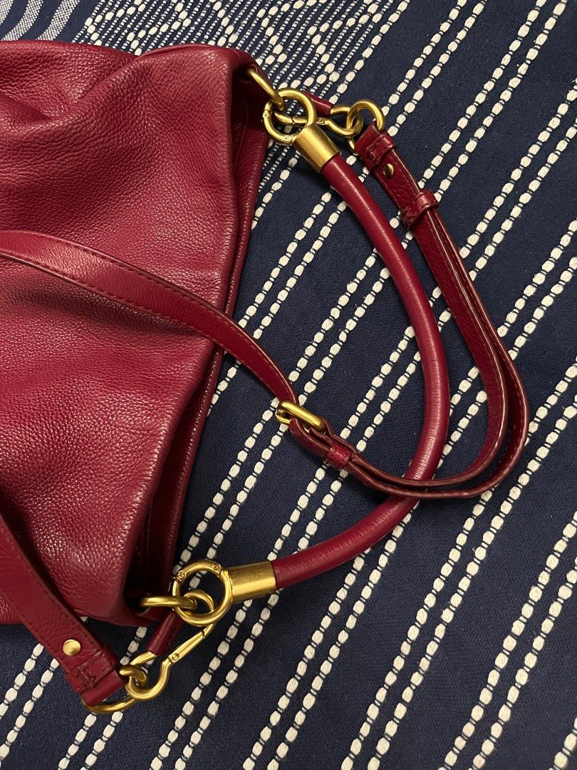 Red Pebbled Leather Crossbody Hobo Shoulder Bag Marc by Marc Jacob (Category: Bags & Wallets) located in Singapore. Submitted by suscir (Listing ID 1372688906, Image 3). Description: Red is not as bright as pictures, the closer colour is picture 3 (handles) Logo faded, on front of bag. Inside lining needs cleaning, reasonable to use if you don’t put anything light colour. Just cleaned with leather gel. Very nice leather. Bag has been well-loved, 