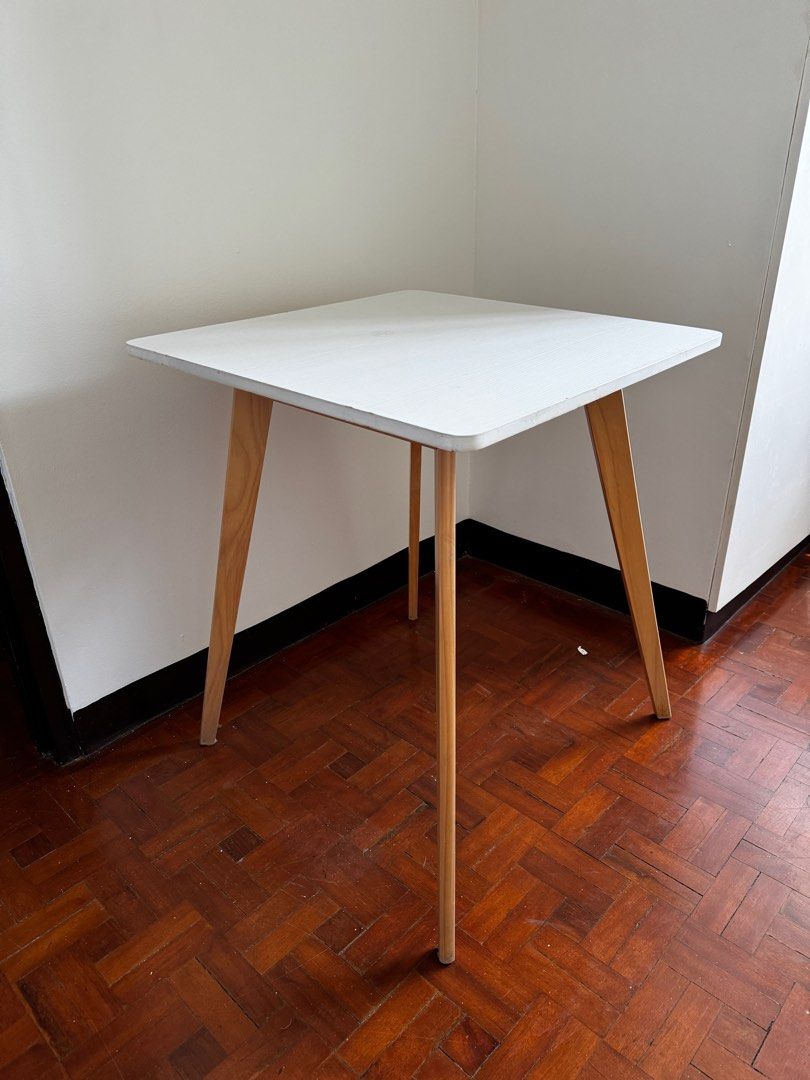Scandinavian Style Wood Table (Category: Tables & Sets) located in Paranaque City. Submitted by lazyskates (Listing ID 1372819612, Image 1). Description: Scandinavian Style Wood Table Used 8/10 condition 60x60x70cm Php1200 negotiable! Issues: chipping on top edge and bottom part of legs (see pics for details) RFS: not being used anymore Pick-up at Parañaque.
