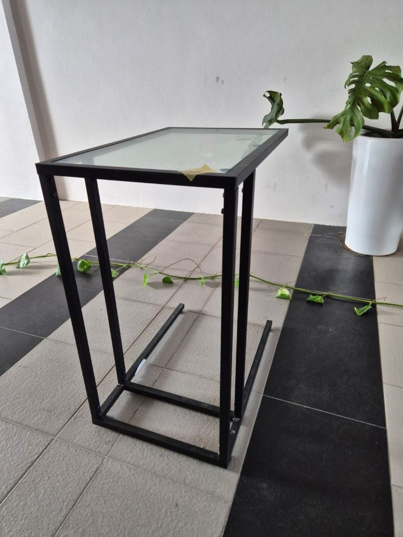 Side Table (Category: Outdoor Furniture) located in Singapore. Submitted by u_siddharth (Listing ID 1372793530, Image 3). Description: Side Table (Glass+Metal) Height: 55 cm Width: 35 cm Length: 55 cm.
