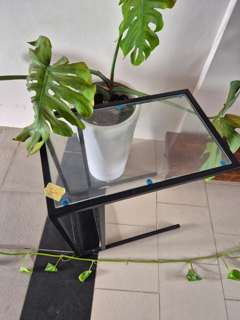 Side Table (Category: Outdoor Furniture) located in Singapore. Submitted by u_siddharth (Listing ID 1372793530, Image 2). Description: Side Table (Glass+Metal) Height: 55 cm Width: 35 cm Length: 55 cm.