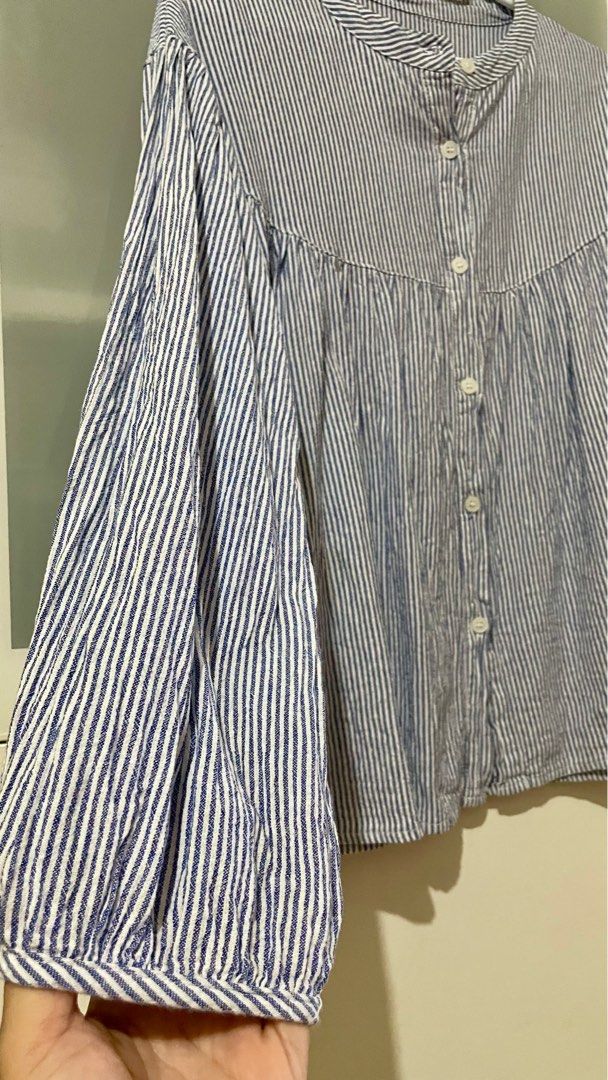 Striped cotton smocked blouse (Category: Blouses) located in Taguig. Submitted by lam_decluttering (Listing ID 1372757818, Image 2). Description: Striped blue cotton smocked blouse can fit small to large .