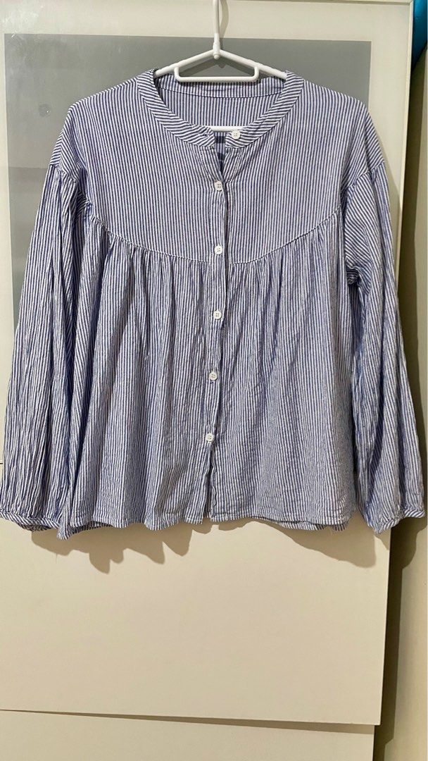 Striped cotton smocked blouse (Category: Blouses) located in Taguig. Submitted by lam_decluttering (Listing ID 1372757818, Image 1). Description: Striped blue cotton smocked blouse can fit small to large .