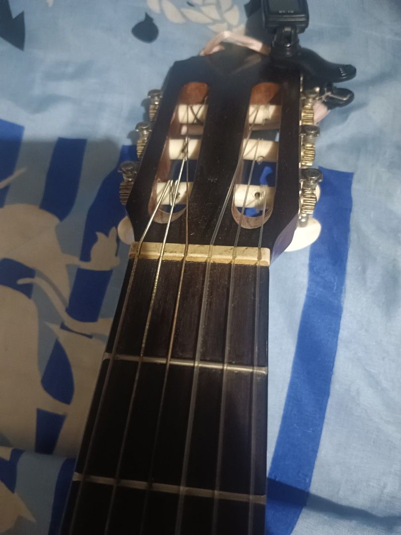 vintage classical guitar (Category: Musical Instruments) located in Manila. Submitted by Jazzer.17 (Listing ID 1372853489, Image 1). Description: vintage classical nylon guitar,rosewood fret board 37 inches size,truss rod w serial number.,,price,3,500 pesos.