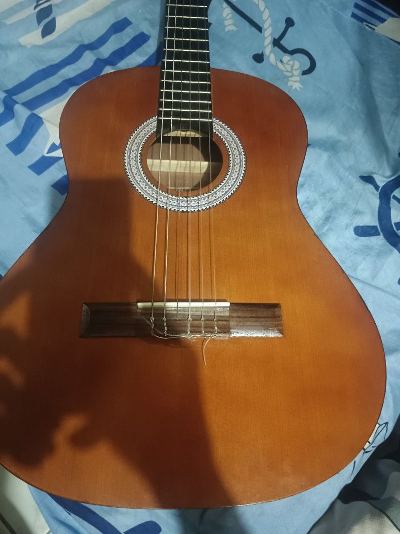 vintage classical guitar (Category: Musical Instruments) located in Manila. Submitted by Jazzer.17 (Listing ID 1372853489, Image 2). Description: vintage classical nylon guitar,rosewood fret board 37 inches size,truss rod w serial number.,,price,3,500 pesos.
