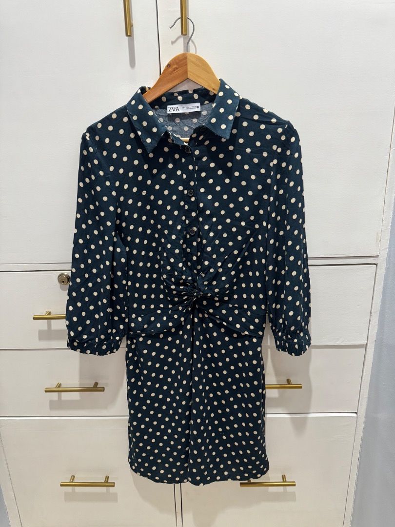 Zara Polka Dots Dress (Category: Dresses) located in Carmona. Submitted by raest16 (Listing ID 1372679631, Image 1). Description: Size: US Large Color: Blue(blue green) with cream polka dots Has knot design to define waist and help disguise any bulges in the belly area.👍🏻 MOP: BDO, Gcash MOD: LBC, J&T - sf c/o buyer Location: Carmona Cavite.