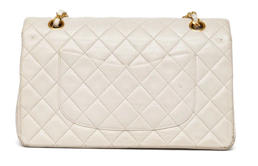 CHANEL MEDIUM CLASSIC DOUBLE FLAP OFF-WHITE (Category: Bags & Wallets) located in Singapore. Submitted by kmurrayy (Listing ID 1377811691, Image 3). Description: Like new, hardly used authentic Chanel bag for sale. Meet up Marina Bay..