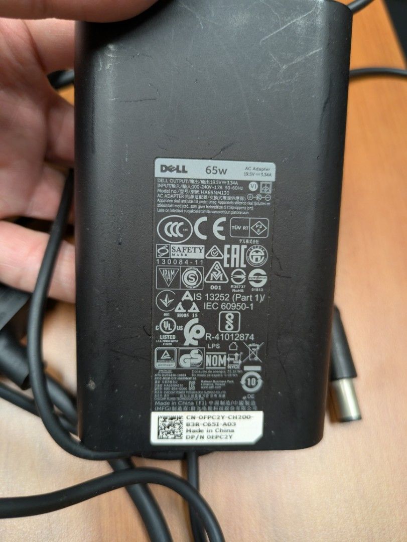 Dell 65W Laptop Charger (Category: Chargers) located in Singapore. Submitted by beststuff_guy (Listing ID 1377801342, Image 2). Description: - Genuine Dell 65W laptop charger - Tested and working - Includes power adapter and cable - Compatible with various Dell laptops - Please verify compatibility with your laptop model.