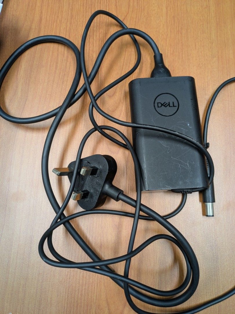 Dell 65W Laptop Charger (Category: Chargers) located in Singapore. Submitted by beststuff_guy (Listing ID 1377801342, Image 1). Description: - Genuine Dell 65W laptop charger - Tested and working - Includes power adapter and cable - Compatible with various Dell laptops - Please verify compatibility with your laptop model.