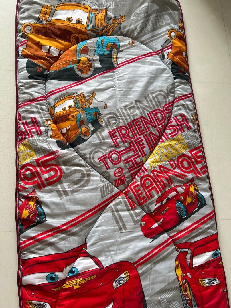 Disney Cars Sleeping Mat (Category: Childrens' Beds) located in Singapore. Submitted by theblingshop (Listing ID 1377762284, Image 1). Description: Cozy Disney Cars sleeping mat, perfect for sleepovers or camping. Features Lightning McQueen and Mater. In good condition, used for only once or twice. Easy to clean and store. Size is approximately 180cm x 73cm..