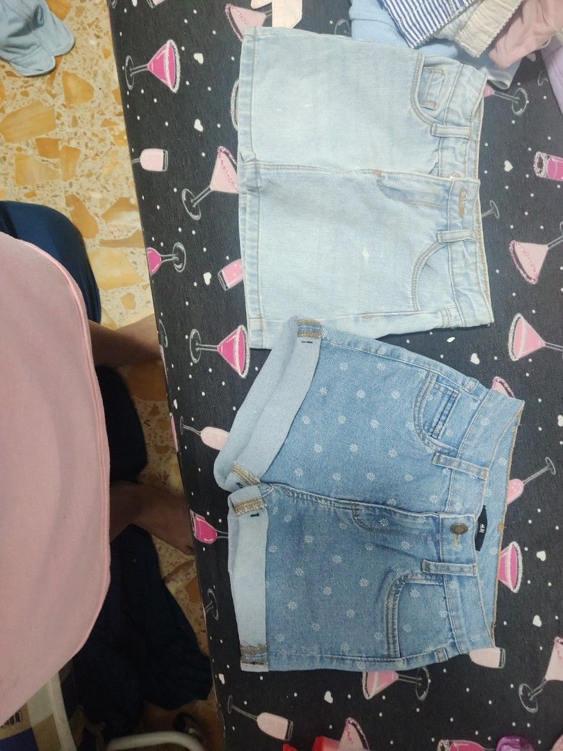 H&M Denim Shorts - Size Unknown (Category: Babies & Kids Fashion) located in Singapore. Submitted by buylahlahlah (Listing ID 1377863766, Image 1). Description: - Two pairs of H&M denim shorts available. - Includes: - Light wash denim skirt - Blue denim shorts with white floral patterns - Both items are in good condition..