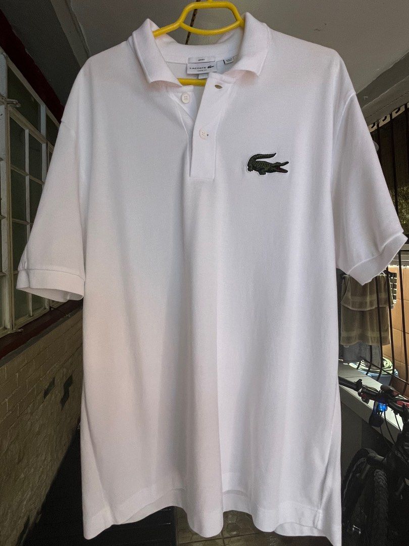 Lacoste Loose Fit White Polo Formal (Category: Tshirts & Polo Shirts ) located in Pasig City. Submitted by save_one (Listing ID 1377802595, Image 1). Description: Lacoste Loose Fit White Unisex Large .