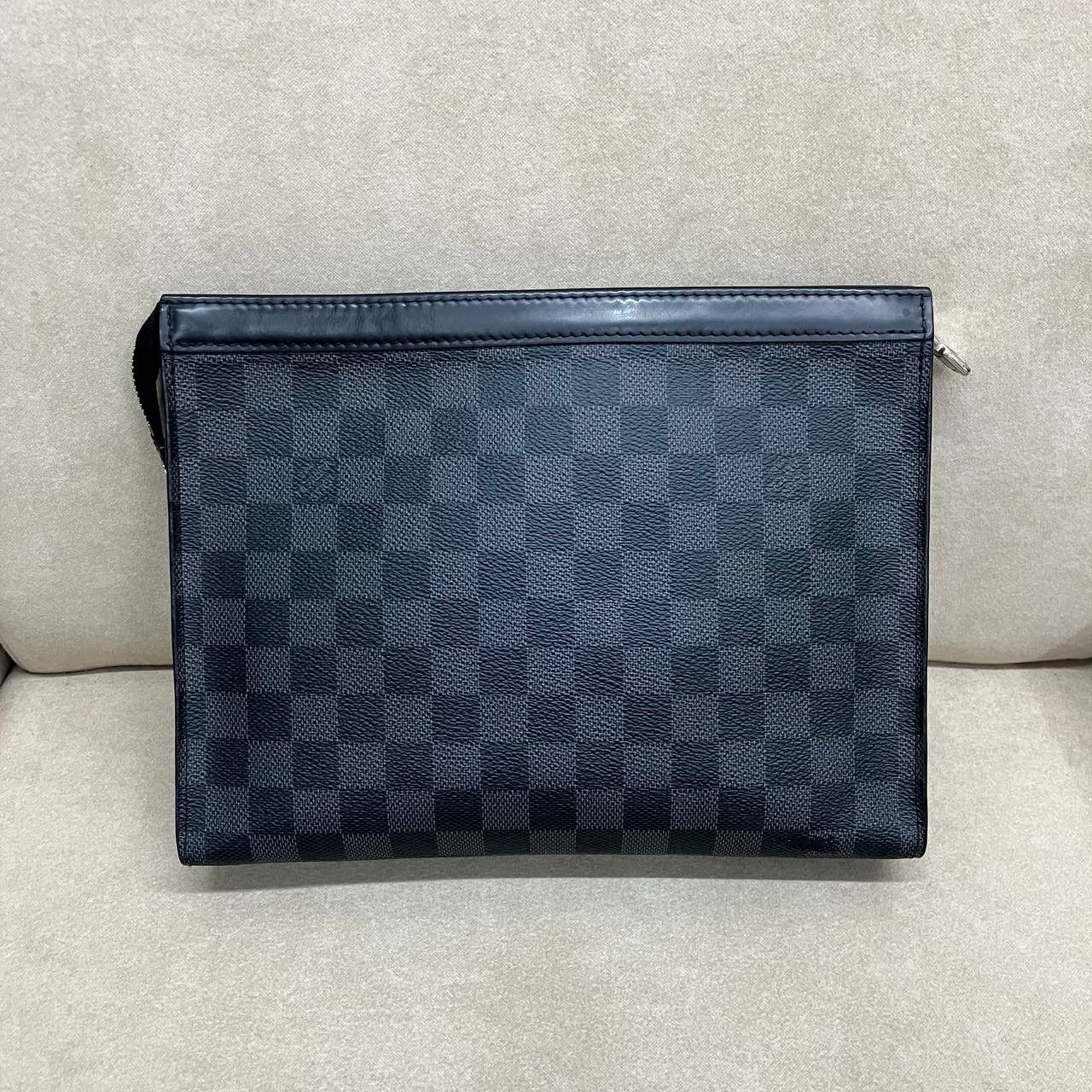 Louis Vuitton Pochette Voyage in Damier Graphite (Local Stock*) (Category: Bags & Wallets) located in Singapore. Submitted by projectlfg (Listing ID 1377840271, Image 3). Description: Louis Vuitton Pochette Voyage in Damier Graphite (Local Stock*) Condition 98% New. Year: SP4197 Accessories: - Note: Fading on bottom* Size: 26x5.5x20 / SGD: 500 • ACRA Registered Company in Singapore • Physical Outlets in Singapore and China • Entrupy Verified Busi