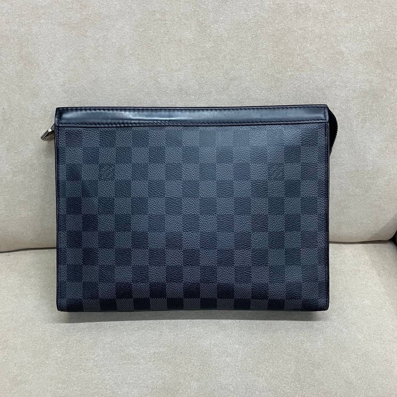 Louis Vuitton Pochette Voyage in Damier Graphite (Local Stock*) (Category: Bags & Wallets) located in Singapore. Submitted by projectlfg (Listing ID 1377840271, Image 2). Description: Louis Vuitton Pochette Voyage in Damier Graphite (Local Stock*) Condition 98% New. Year: SP4197 Accessories: - Note: Fading on bottom* Size: 26x5.5x20 / SGD: 500 • ACRA Registered Company in Singapore • Physical Outlets in Singapore and China • Entrupy Verified Busi