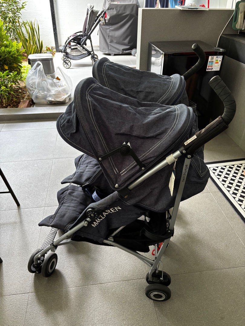 Maclaren Twin Triumph Stroller - Denim twin stroller (Category: Strollers) located in Singapore. Submitted by wolfman13 (Listing ID 1377791287, Image 3). Description: Maclaren Twin Triumph stroller in denim. Features individual sun canopies, reclining seats, and a compact fold for easy storage. Includes safety harnesses. Super hardy, it’s a maclaren! My 2nd maclaren pram! Easily flows to a compact size! Excellent perfect condition! Hardly used, a