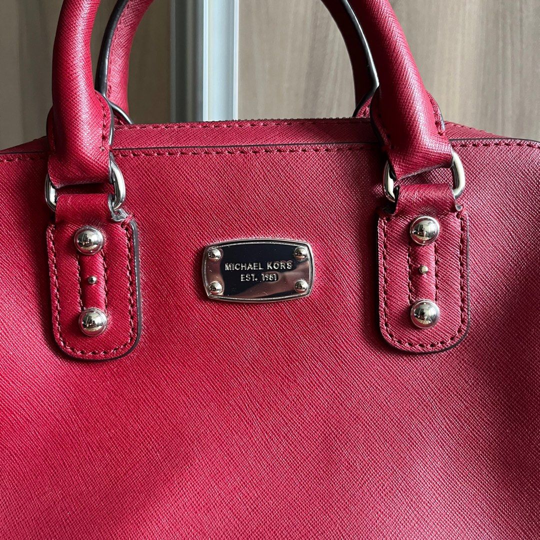 Michael Kors Handbag (w long strap) (Category: Luxury Bags & Wallets) located in Makati City. Submitted by 4635archives (Listing ID 1377813893, Image 3). Description: Michael Kors Red / Burgundy Handbag Comes with a long detachable strap Lightly used but please manage your expectations as this was stored for quite some time.