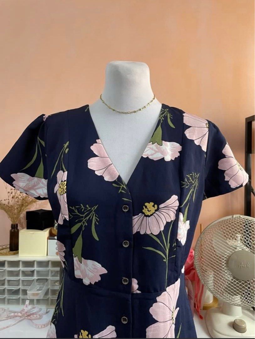 Navy Blue Floral Dress (Category: Dresses) located in Pasig City. Submitted by somedecluttering (Listing ID 1377779657, Image 2). Description: Large on Tag Working Buttons Double Lining length: 34 inches Sleeves Length: 7 inches Armpit to Armpit: 19 inches.