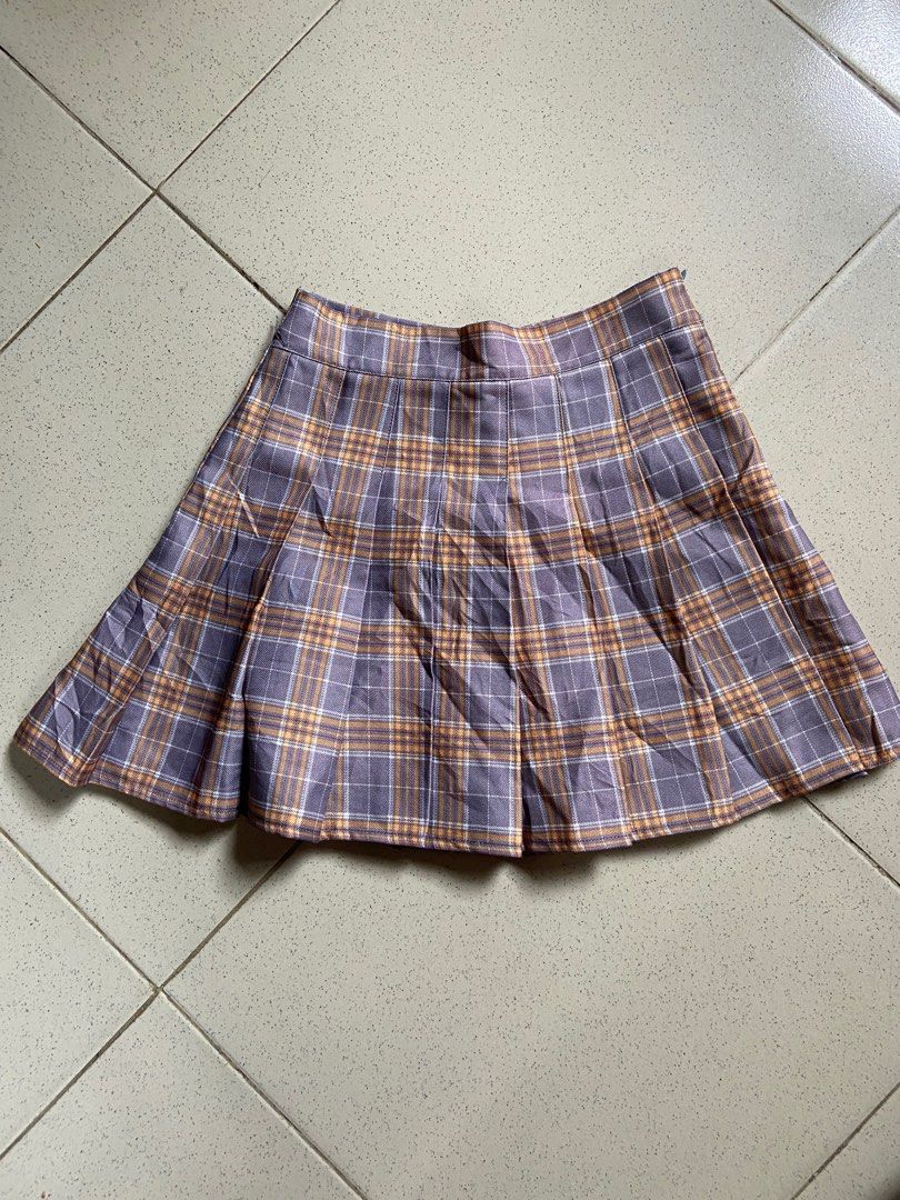 Plaid Tennis Skirt (Category: Skirts) located in Cebu City. Submitted by declutteringgstufff (Listing ID 1377845128, Image 1). Description: Price: Php 100 Size: 24-25 Length: 14in - has built-in shorts - material is thick quality - side zip closure - color combi is lavender and muted orange - per for travel OOTDs ✨ PM if interested. Available for meet-up/shipping..