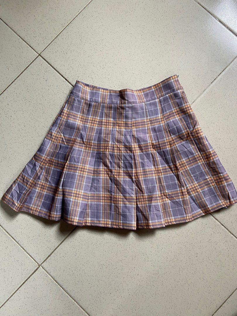 Plaid Tennis Skirt (Category: Skirts) located in Cebu City. Submitted by declutteringgstufff (Listing ID 1377845128, Image 2). Description: Price: Php 100 Size: 24-25 Length: 14in - has built-in shorts - material is thick quality - side zip closure - color combi is lavender and muted orange - per for travel OOTDs ✨ PM if interested. Available for meet-up/shipping..