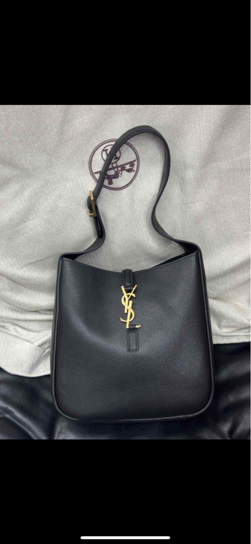Saint Laurent black leather hobo bag (Category: Shoulder Bags) located in Cebu City. Submitted by simpleabundance (Listing ID 1377845089, Image 2). Description: Authentic Medium size Saint Laurent leather hobo bag Adjustable shoulder strap, designer plaque, internal zip-fastening pouch, fully lined Logo hook fastening at open top .