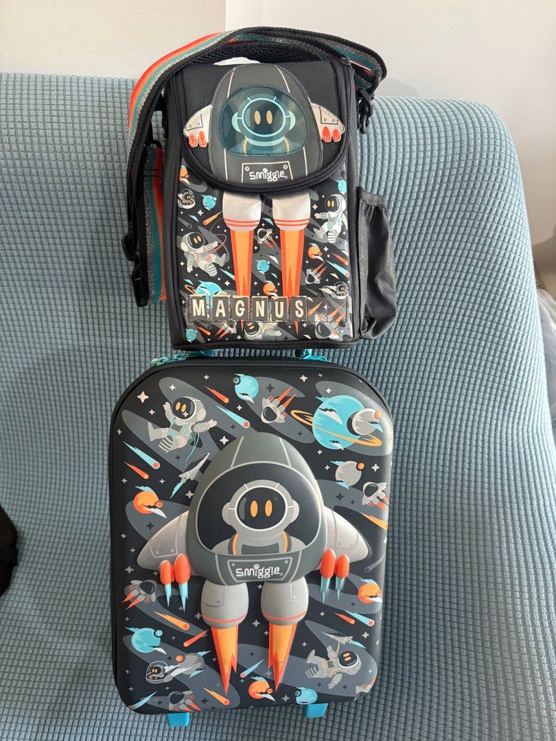Smiggle Blast off Junior Trolley bag and lunch bag (Category: Babies & Kids Fashion) located in Manila. Submitted by polaignacio (Listing ID 1377756872, Image 1). Description: Travel in style with this adorable Blast off Trolley Bag with 3D, embossed character details! Little hands can easily grab and go with the adjustable carry handle and super smooth wheels. Plus, inner mesh pockets make packing a dream! One zipped compartment Embossed 3D fron