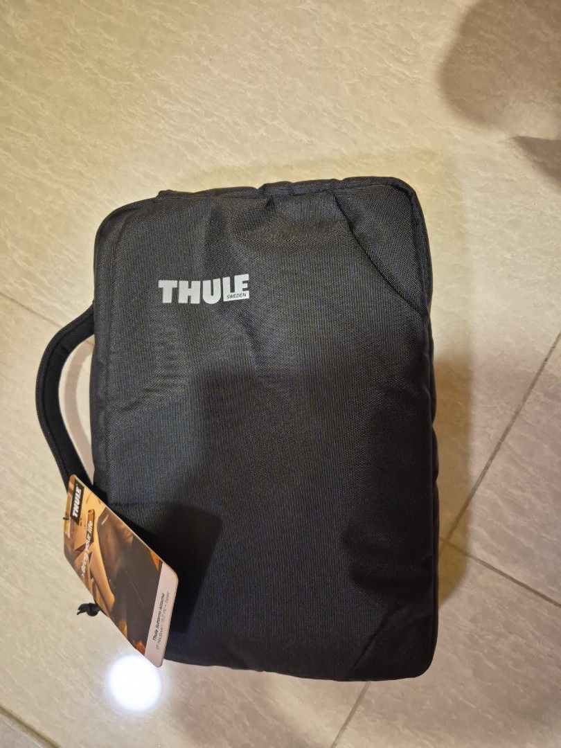 Thule Laptop Bag - Black (Category: Laptop Bags & Sleeves) located in Singapore. Submitted by kennethzz (Listing ID 1377841049, Image 1). Description: - Thule laptop bag in excellent condition - Stylish black design - Comfortable handle - Includes original tags - Perfect for laptop and essentials - Great for everyday use or travel.