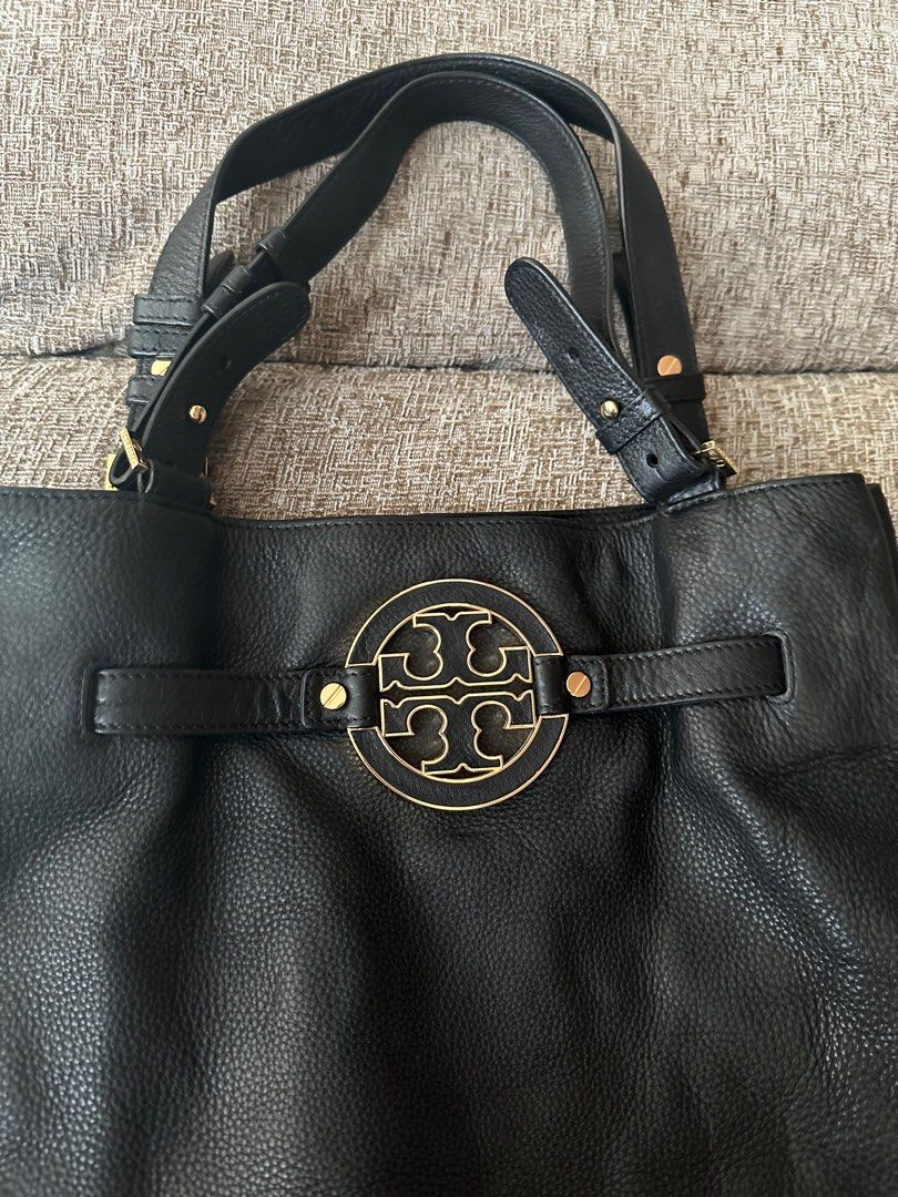 Tory burch Amanda Tote (Category: Luxury Bags & Wallets) located in Manila. Submitted by onestopboutique (Listing ID 1374271797, Image 2). Description: •100% Authentic •With dust bag + paper bag •Color: Black •Shoulder/Top Handle/Document Bag •Pebble-Grained Calf Leather •Designer Logo Plaque on Front •Double Leather Shoulder Straps •Concealed Magnetic Closure •Adjustable Drawstring Detail •Gold Hardware •1 Interior Zip Pocket, 2 Multi-Functional